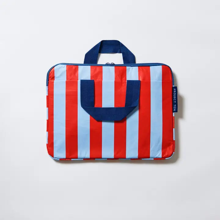 Striped bag with red, white, and blue colors on a light gray background