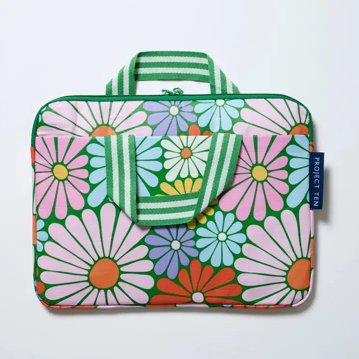 Floral patterned laptop sleeve with a matching pouch on a light gray background