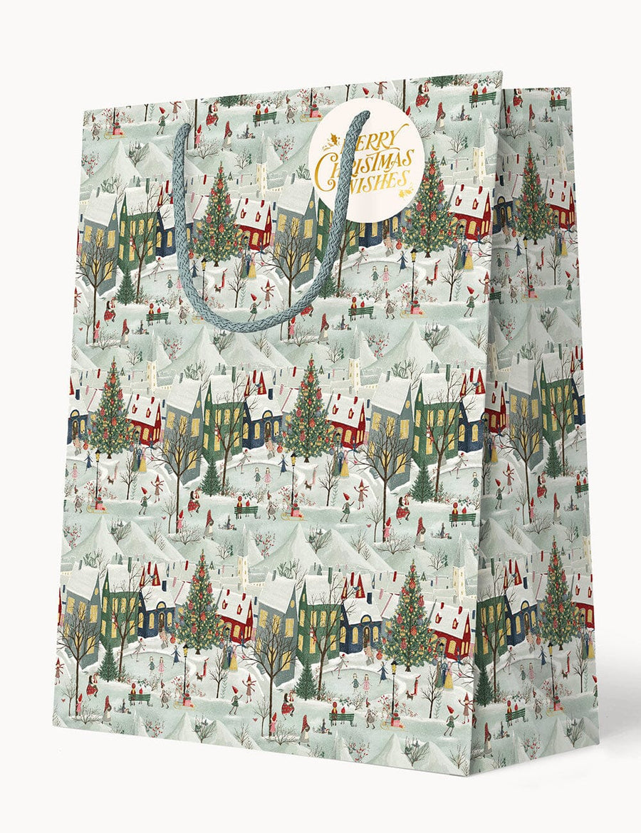 Gift bag with Christmas village design on a white background