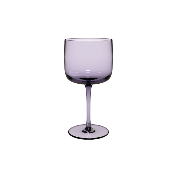 Purple wine glass on a white background