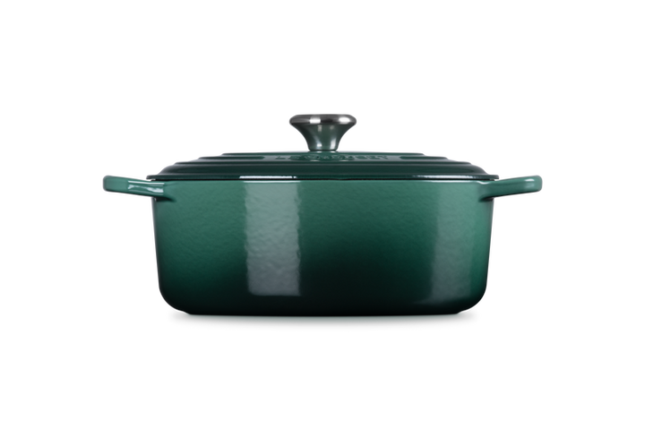 Green enameled cast iron rectangular Dutch oven on a white background
