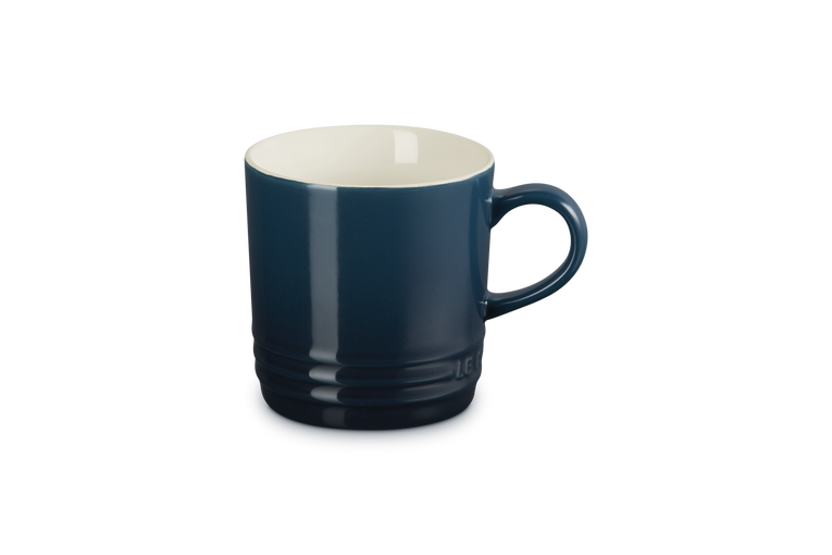 Blue mug with a white interior on a white background