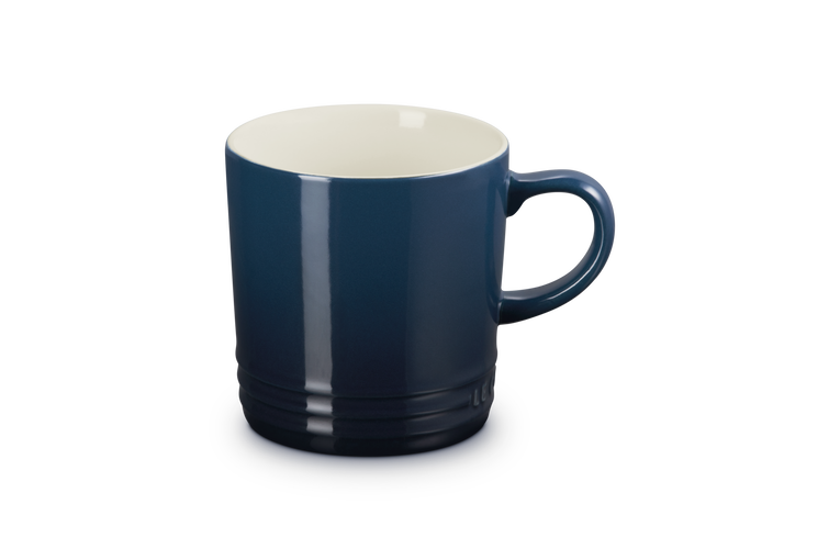 Blue mug with a white interior on a white background