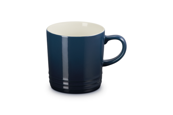 Blue mug with a white interior on a white background