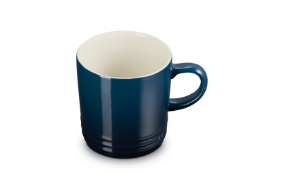 Blue mug with a white interior on a white background