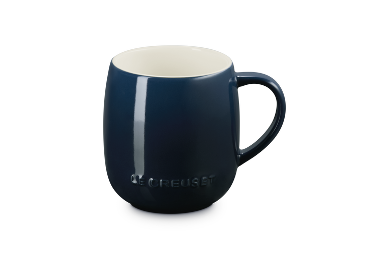 Blue mug with a white interior on a white background