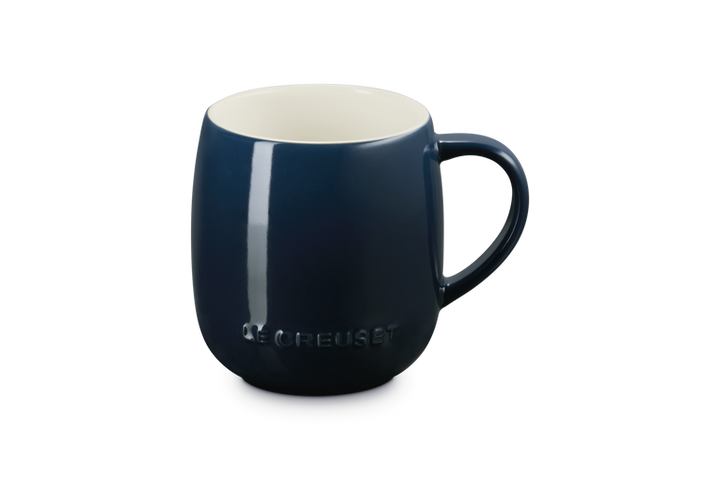 Blue mug with a white interior on a white background