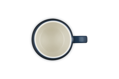 Blue mug with a beige interior on a white background