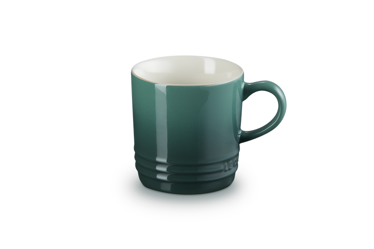 Green mug on a white background