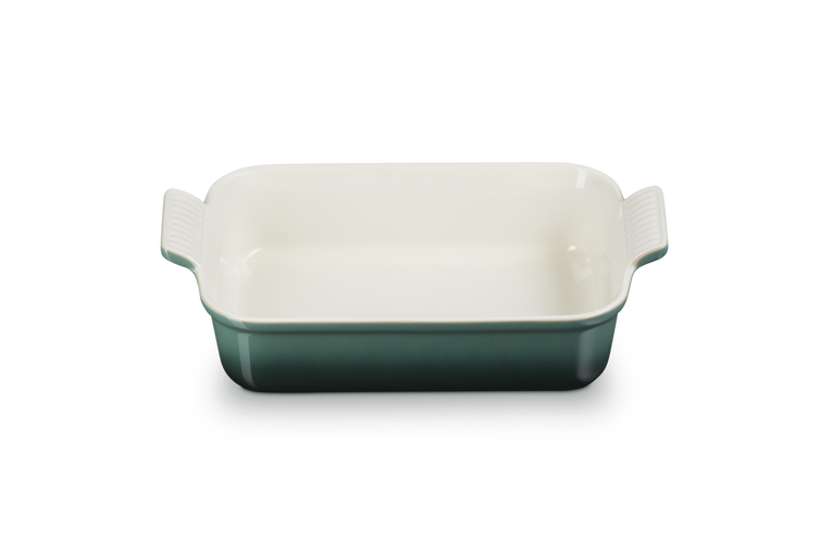 Rectangular baking dish with handles in green and white on a white background