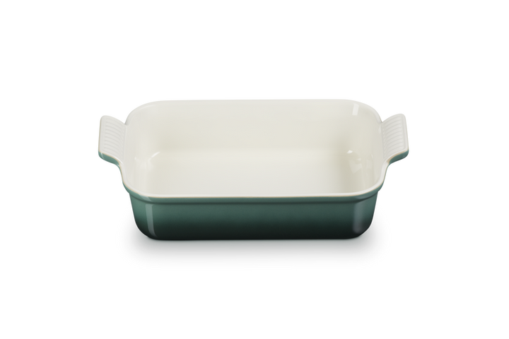 Rectangular baking dish with handles in green and white on a white background