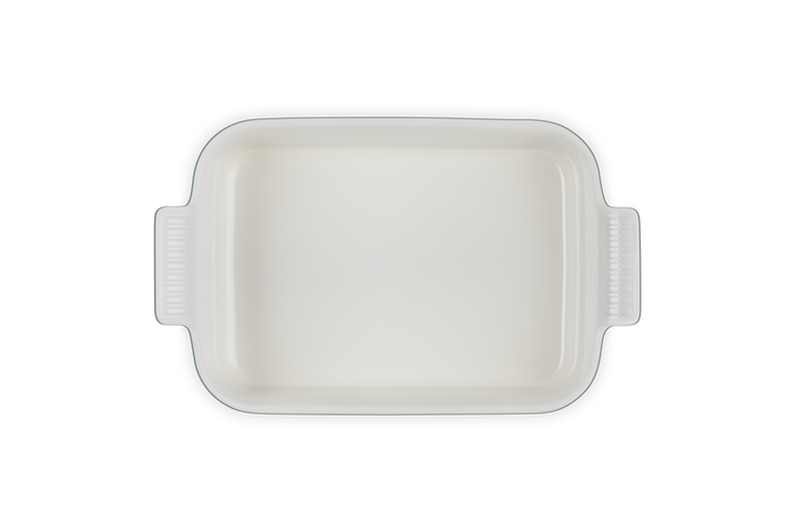 Rectangular white ceramic baking dish on a white background