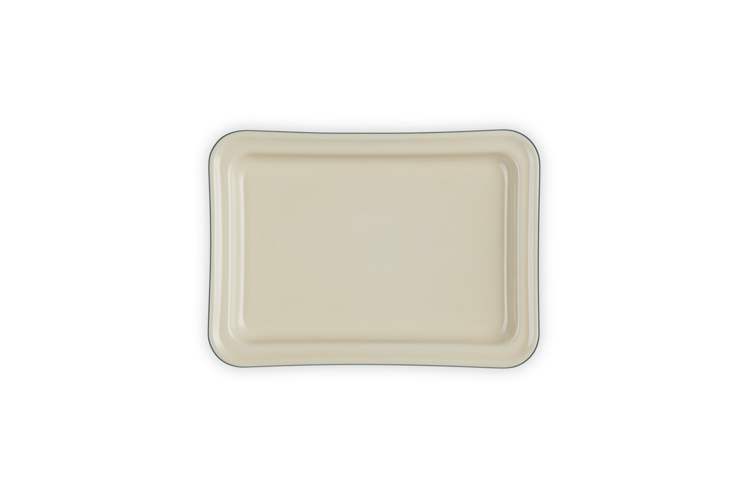 Rectangular ceramic base of a butter dish on a white background