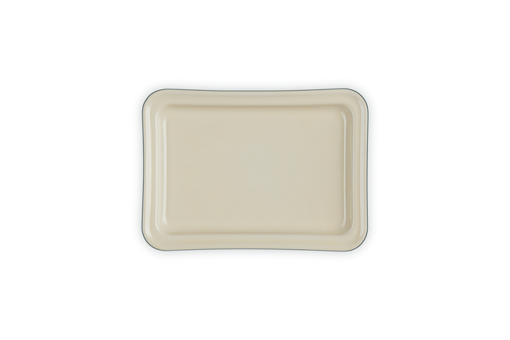 Rectangular ceramic base of a butter dish on a white background