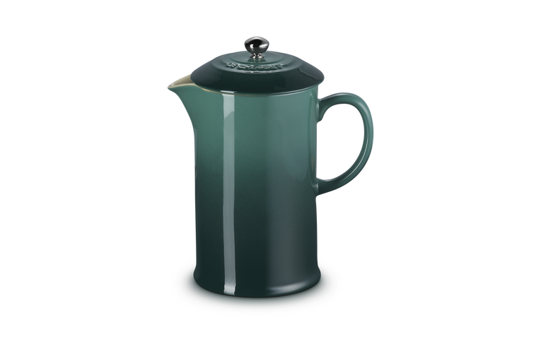 Green French press coffee maker on a white background