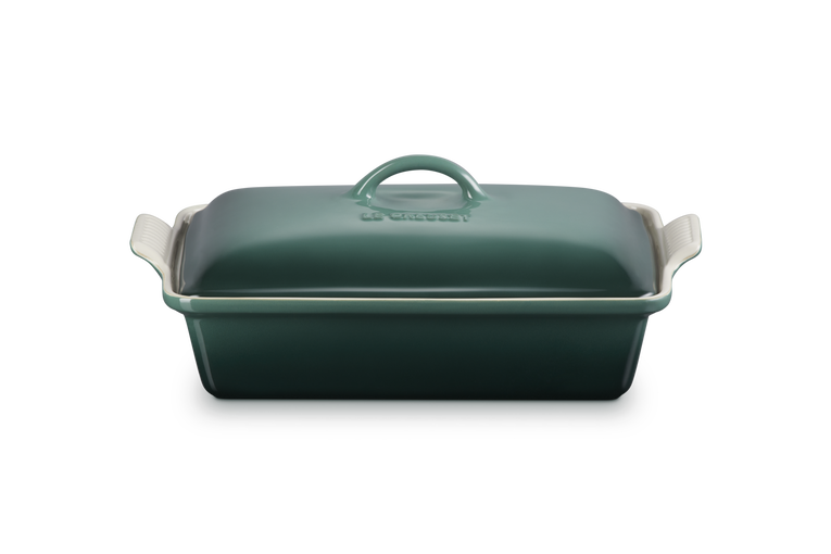 Green rectangular baking dish with a lid on a white background