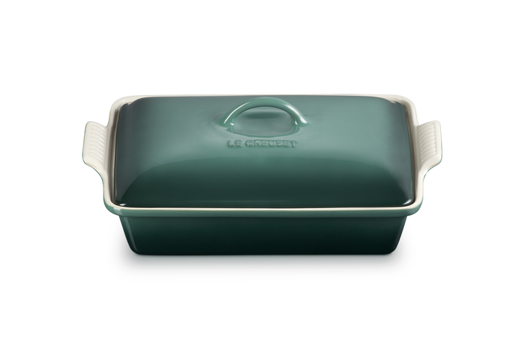 Green rectangular baking dish with a lid on a white background