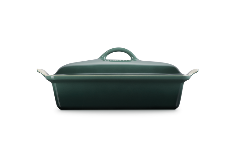 Green rectangular baking dish with a lid on a white background