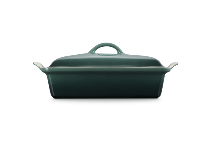 Green rectangular baking dish with a lid on a white background