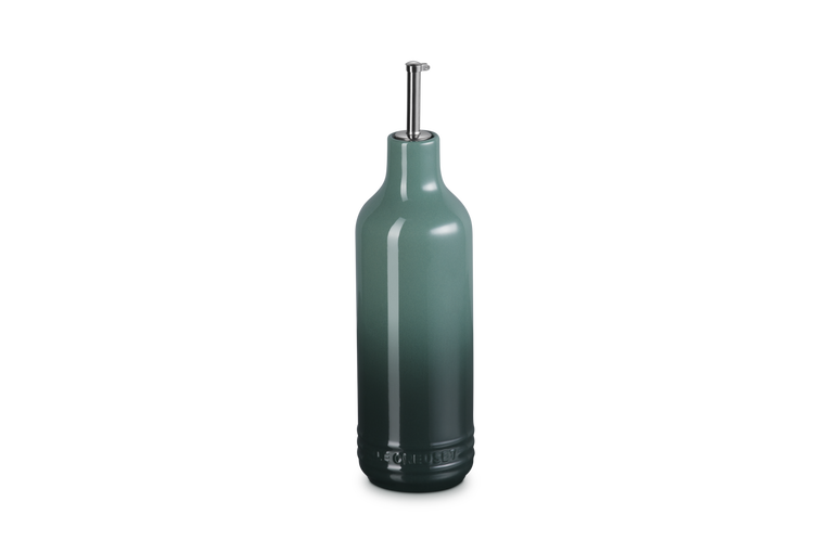 Dark green olive oil bottle with a cap on a white background