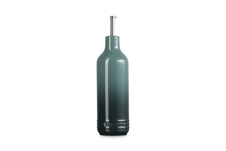 Dark green olive oil bottle on a white background