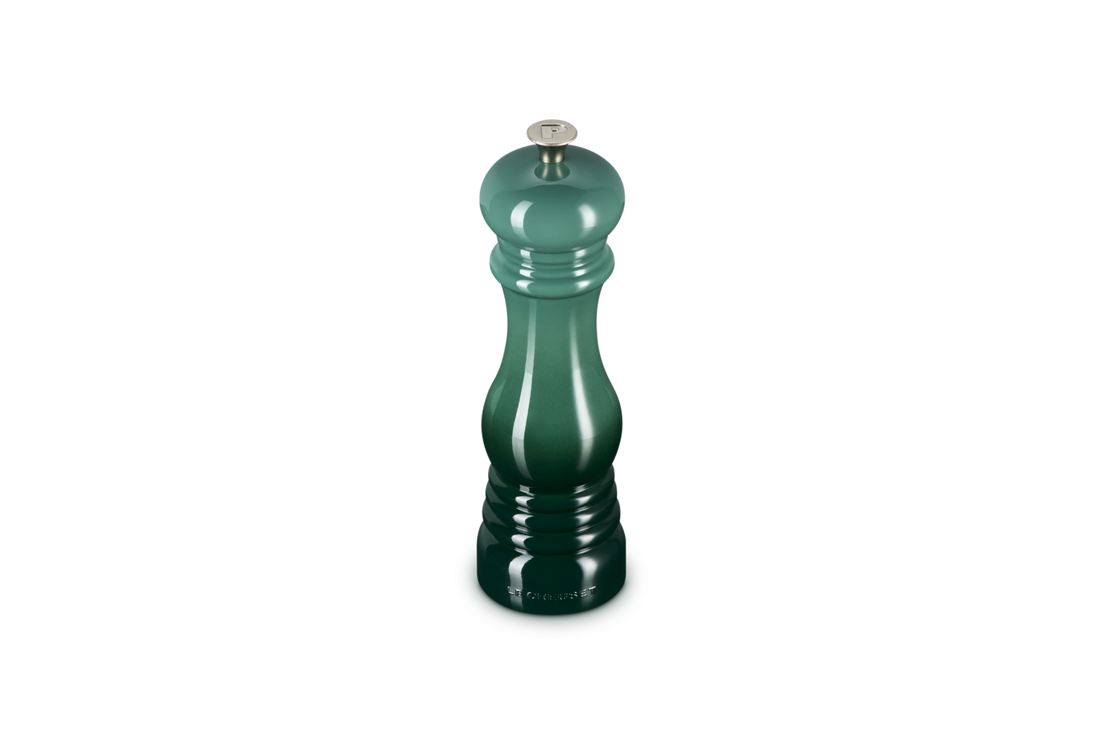 Green pepper grinder on a white background
