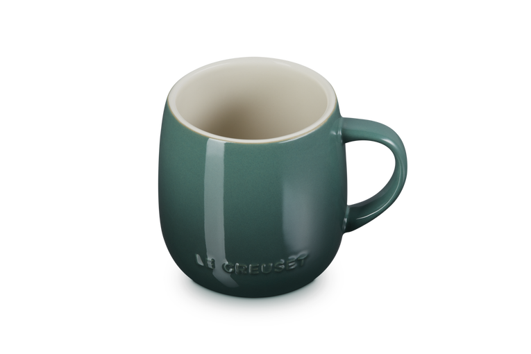 Green mug with a brand logo on a white background