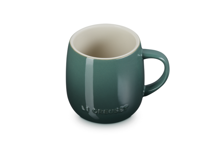 Green mug with a brand logo on a white background