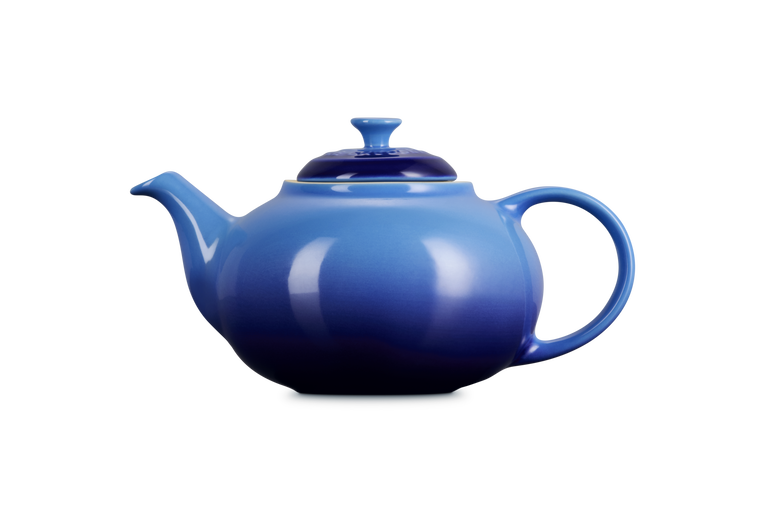 Blue teapot on a white background
