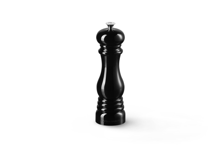 Black pepper grinder on a white background