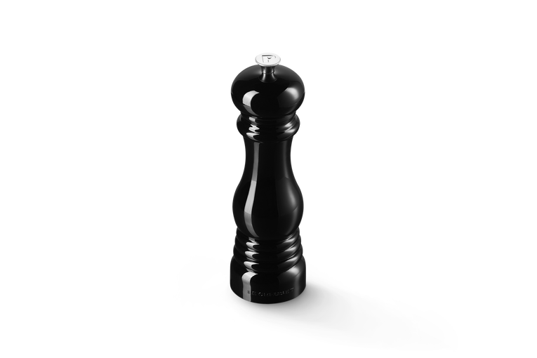 Black pepper grinder on a white background