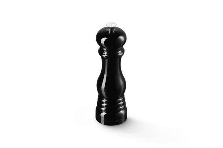 Black pepper grinder on a white background