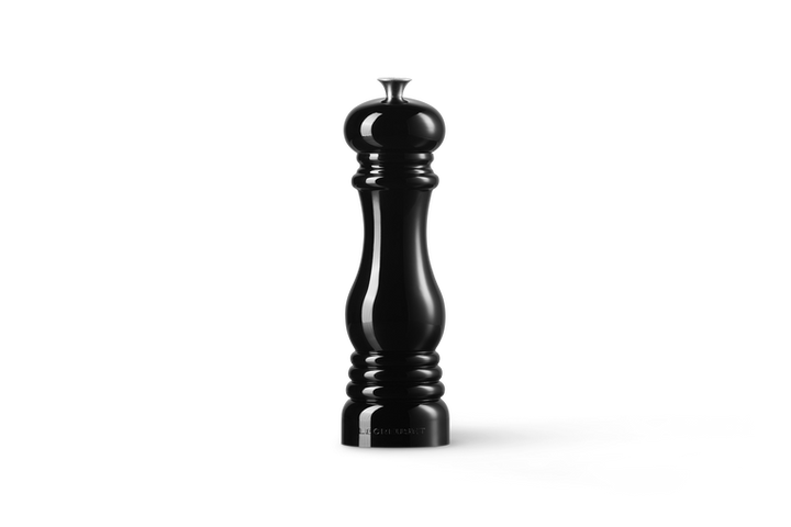 Black pepper grinder on a white background