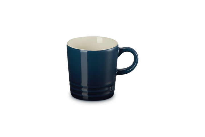 Blue mug with a white interior on a white background