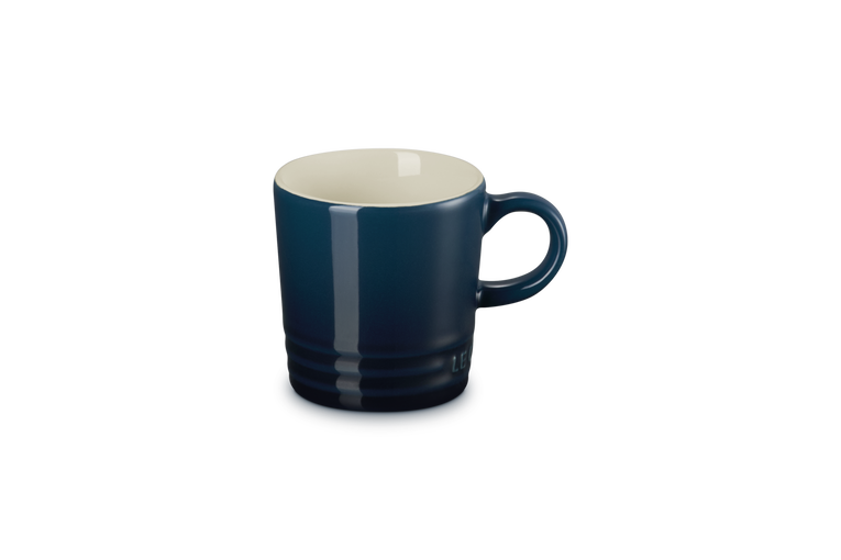 Blue mug with a white interior on a white background