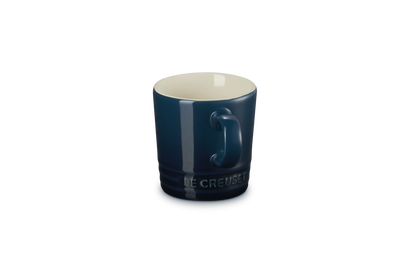 Blue mug with white interior on a white background