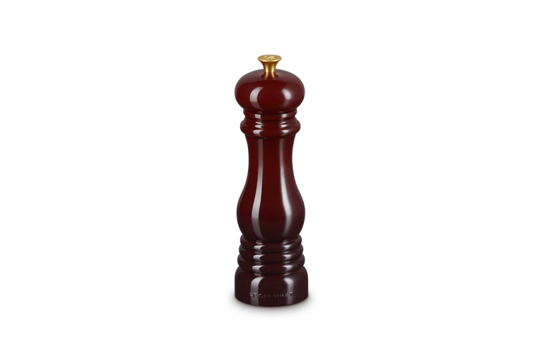 Burgundy salt grinder on a white background