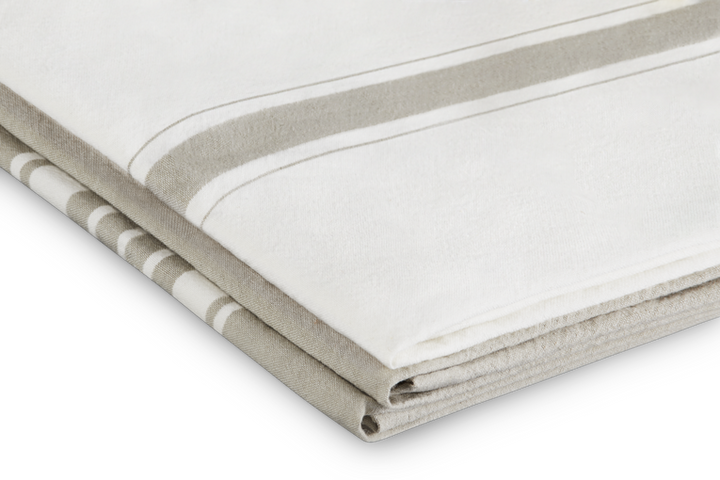 Folded tea towels with striped pattern on a white background