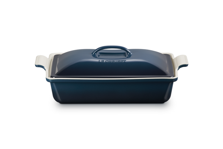 Blue rectangular baking dish with a lid on a white background