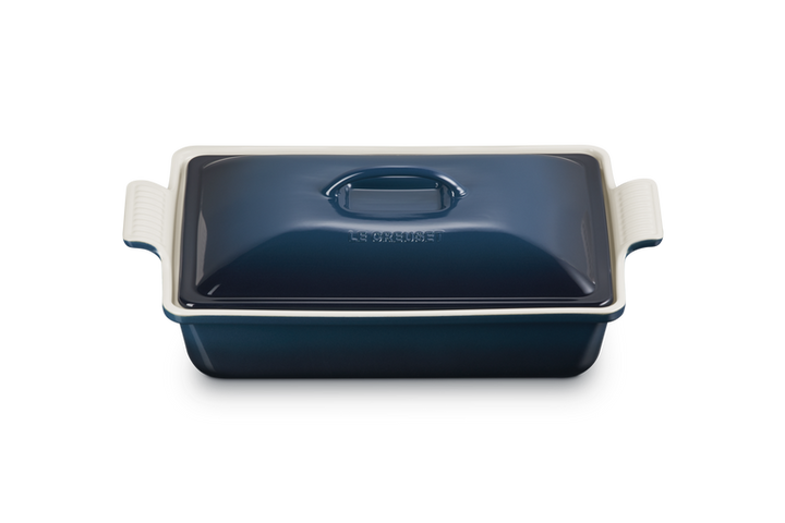 Blue rectangular baking dish with a lid on a white background