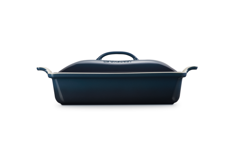 Blue rectangular baking dish with a lid on a white background