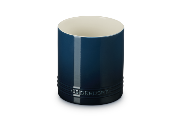 Blue ceramic utensil jar with 'Le Creuset' branding on a white background