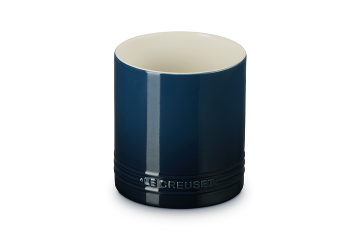Blue ceramic utensil jar with 'Le Creuset' branding on a white background