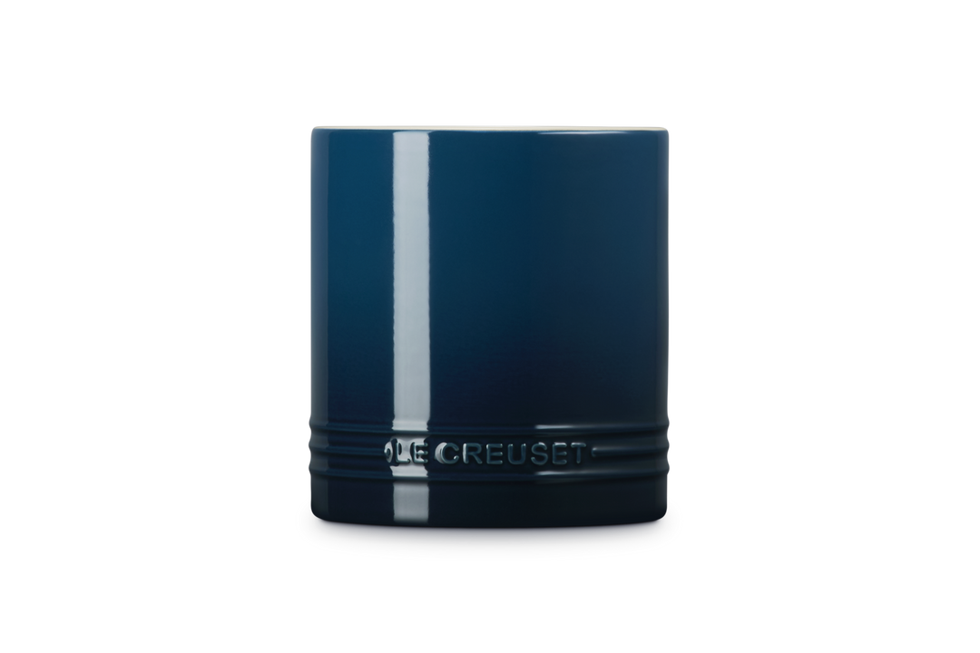 Blue utensil jar with 'Le Creuset' branding on a white background