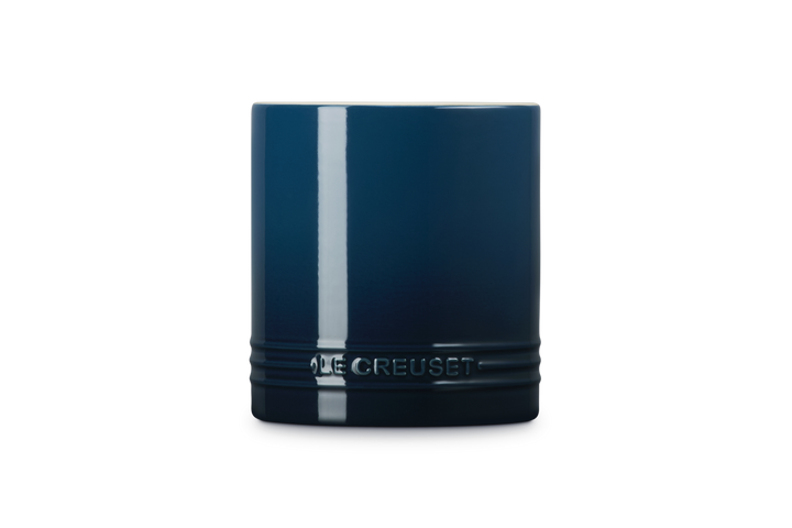 Blue utensil jar with 'Le Creuset' branding on a white background