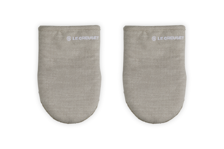 Pair of gray oven mitts with Le Creuset logo on a white background