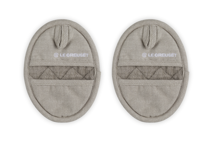 Two beige pot holders with &