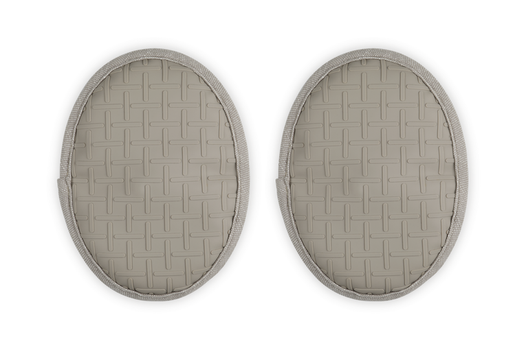 Two oval-shaped beige pot holders with a woven pattern on a white background