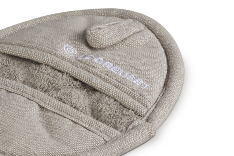 Beige pot holder with a visible brand logo on a white background
