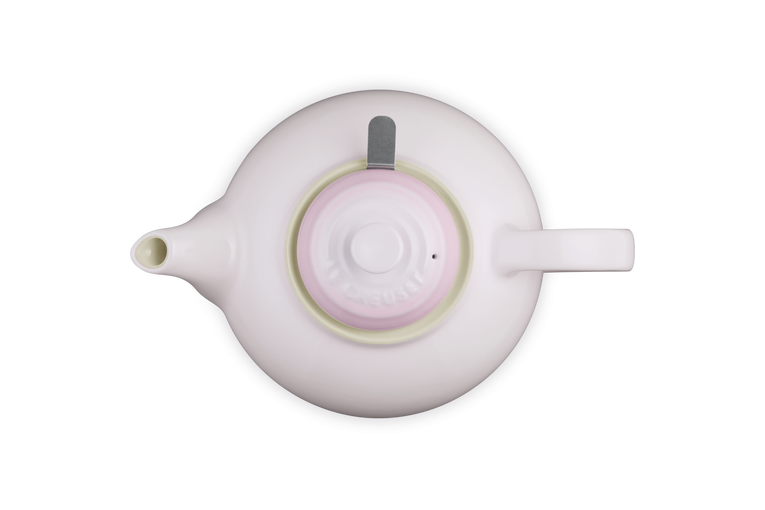 Pink teapot  on a white background